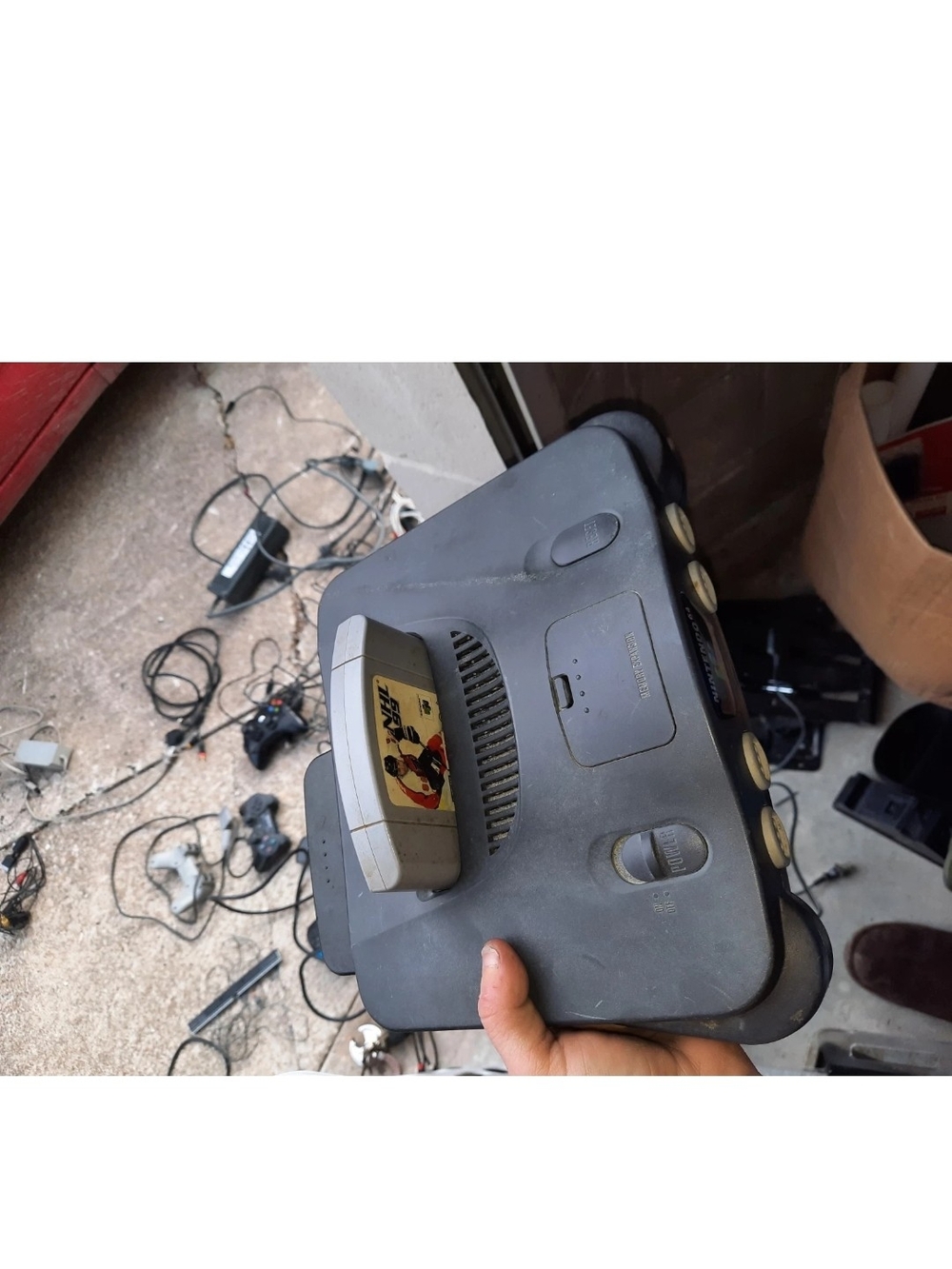 Nintendo Black N64 Console with Inserted Game Cartridge